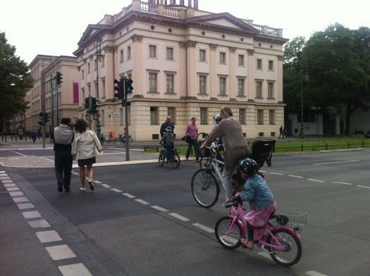 A great system of cycling crosswalks keep cyclists mounted through intersections, and make way for younger cyclists.